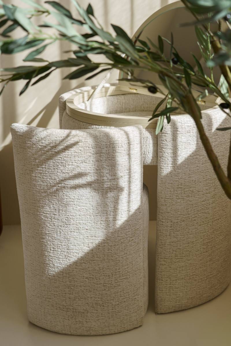 Closed, the Vanora reads as a sculptural side table